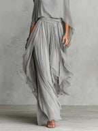Isabella - Conjunto con top fluido de hombros descubiertos y pantalones de chifón