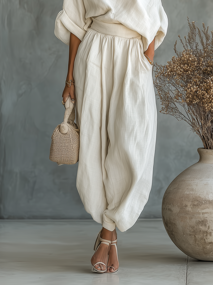 Conjunto de lino blanco roto para mujer con top de hombros descubiertos y pantalones de corte entallado • Talla S1