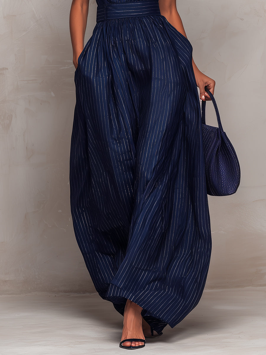 Anna - Tuta azul scuro de rayas con escote con abertura y pantalones de pierna ancha