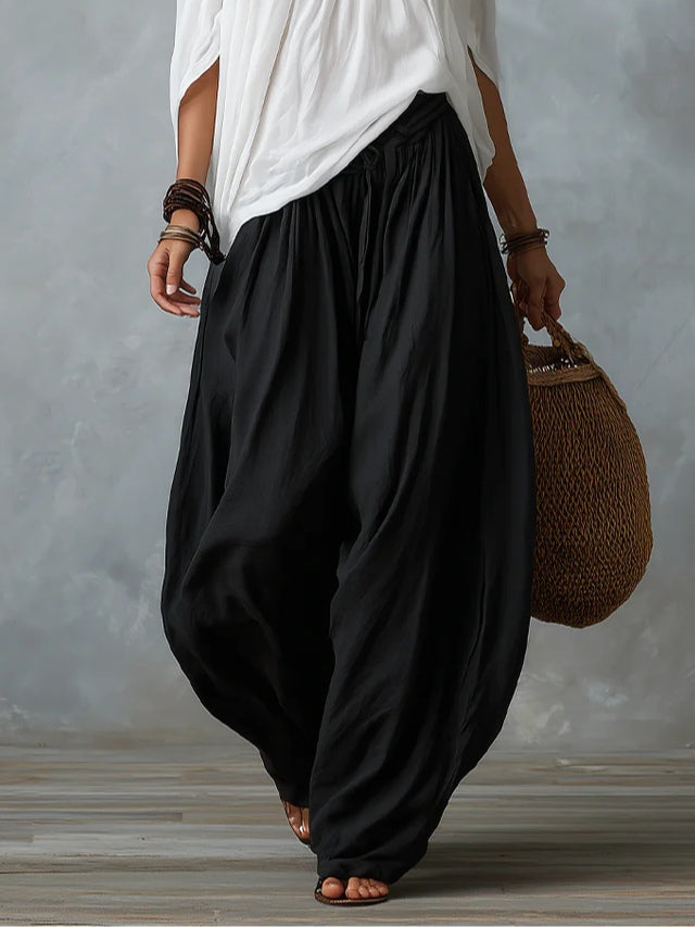 Conjunto de Top Blanco con Hombros Descubiertos y Pantalones Anchos