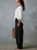 Set Top Blanco Off-Shoulder y Pantalones Anchos